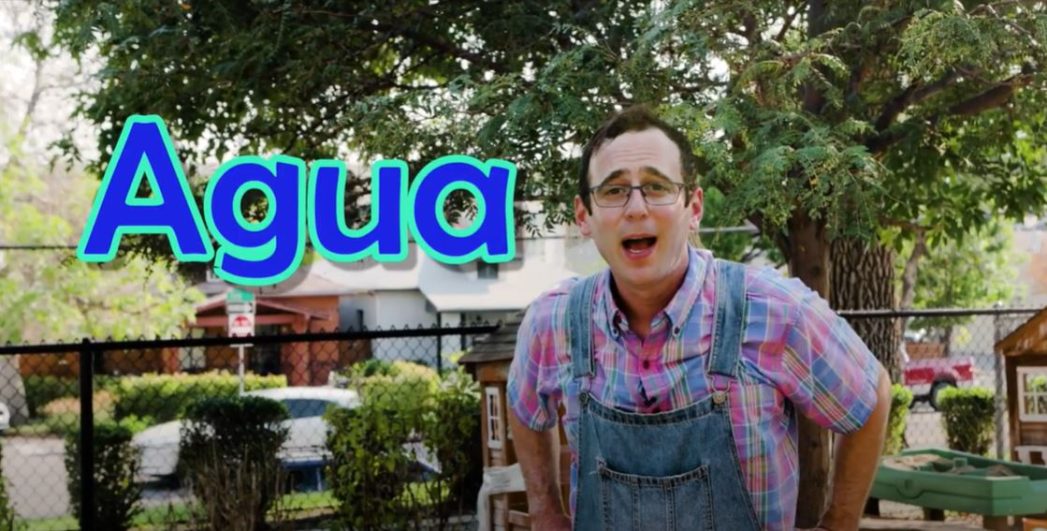 Photo of Farmer Dave in front of a tree with the word "Agua" in blue text superimposed over photo.