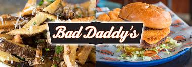 Black banner with white text saying, "Bad Daddy's" over the top of two photos: French fries on left and hamburger on right.
