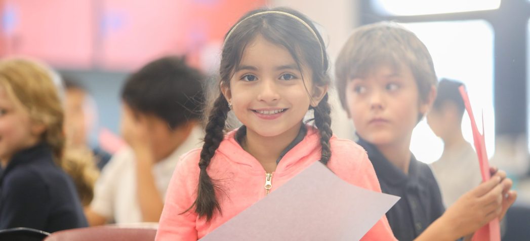 Student in pink shirt, smiling