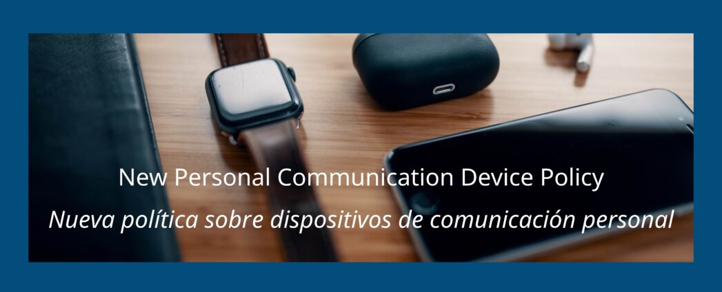 Background is a photo with a smart watch, ear buds, and cell phone. White text overlaid says, "New Communication Device Policy" and "Nueva política sobre dispositivos de comunicación personal"