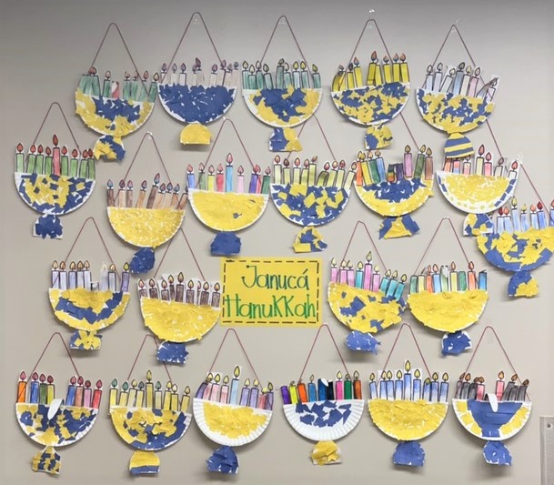 Photo of children's artwork of menorahs for Hanukkah.