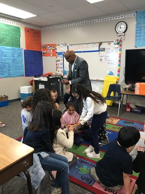 Mayor Michael Hancock talking to students in a classroom.