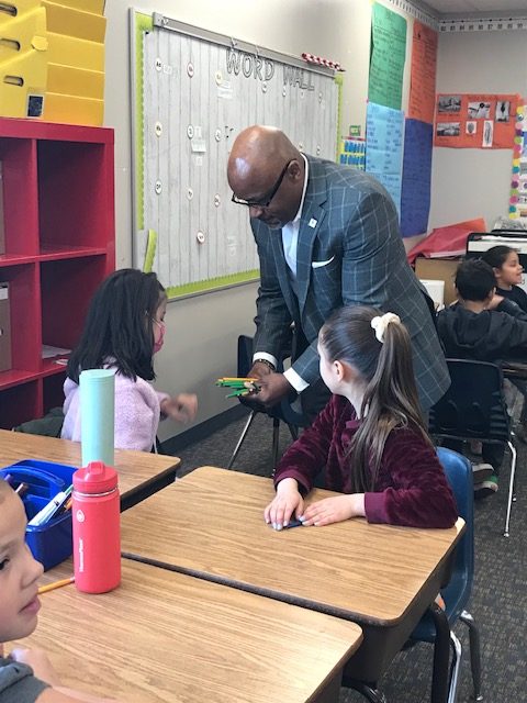 Mayor Michael Hancock talking to students in a classroom.
