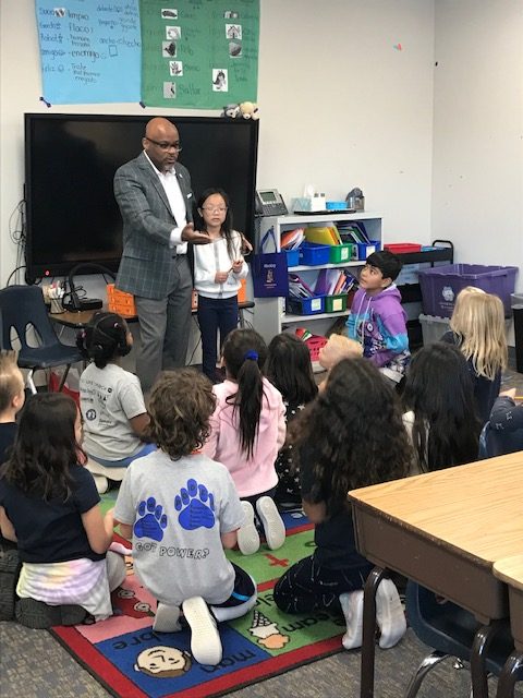 Mayor Michael Hancock talking to students in a classroom.