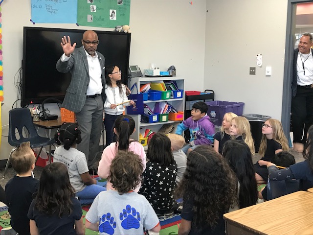 Mayor Michael Hancock talking to students in a classroom.