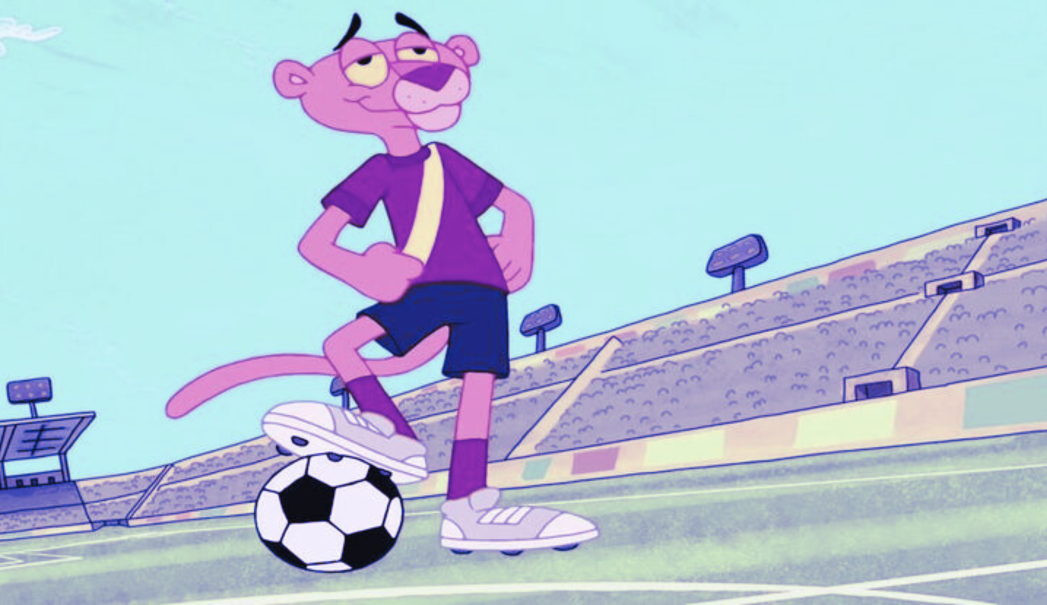 Animated graphic of a panther wearing a soccer outfit with one foot on a soccer ball. Background is a soccer stadium.