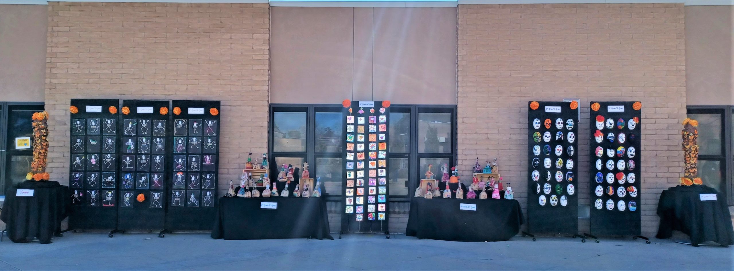 Display for Dia de los Muertos featuring student artwork