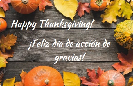 Image of pumpkins and autumn leaves framing the text: "Happy Thanksgiving!" and "¡Feliz dia de accion de gracias!